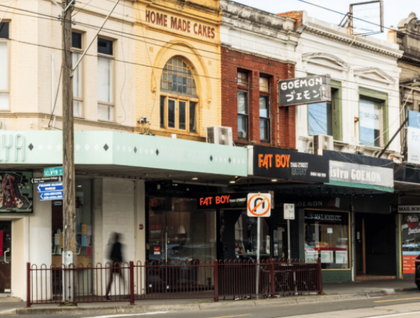 Photo showing a street in Elsternwick with local shops in background