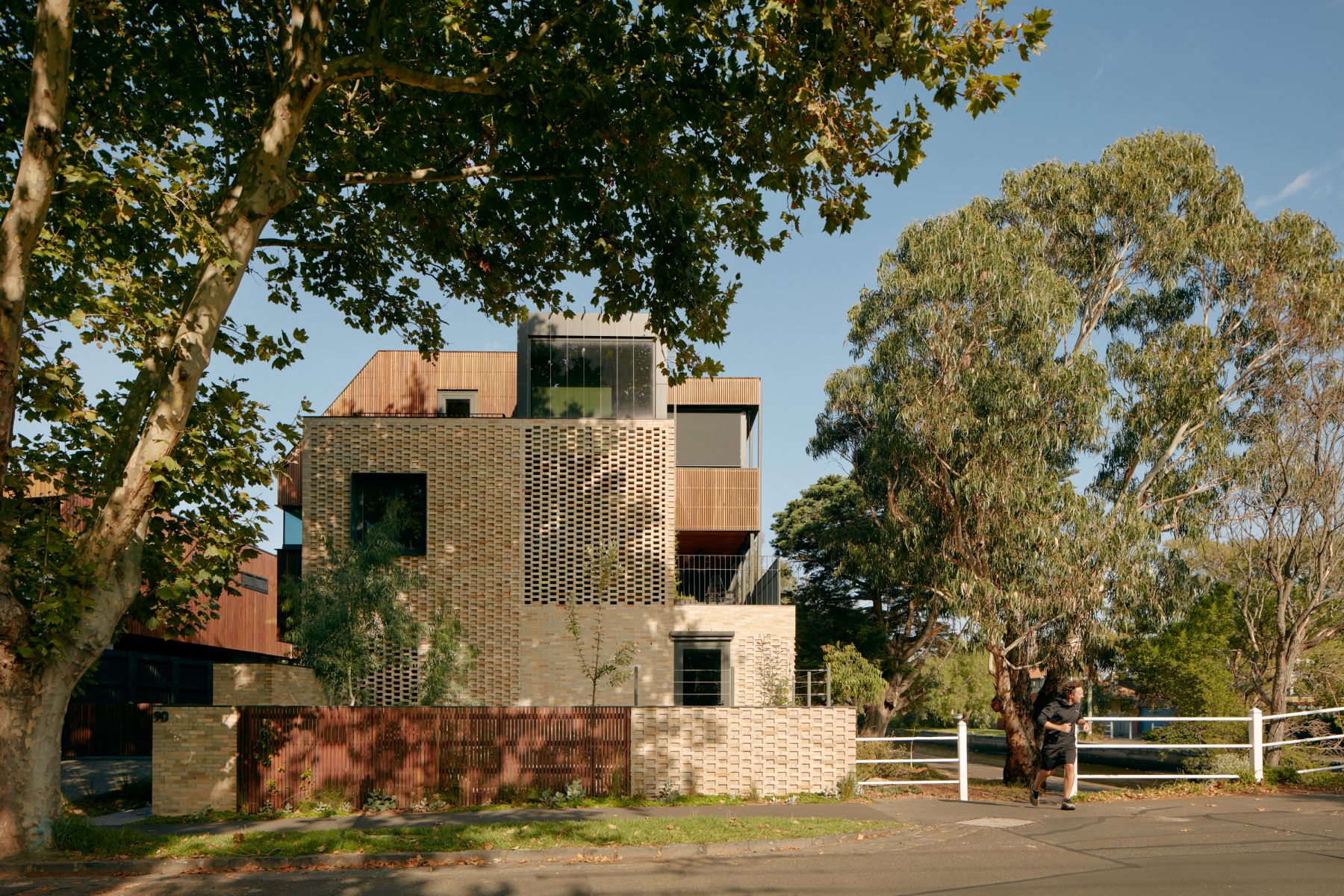Photo of Ruskin Street apartments. Depicts exterior of building situated in a green leafy neighbourhood.
