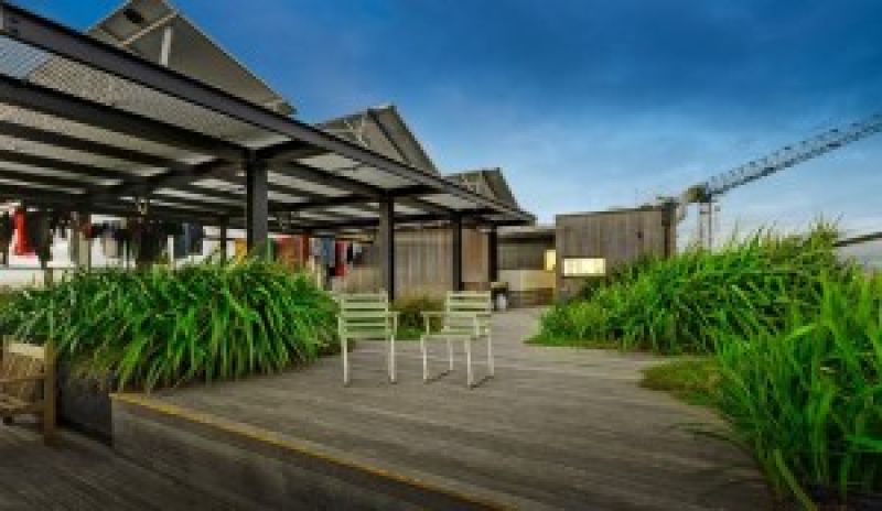 Image of outdoor rooftop space with decking, space to hang washing, deck chairs