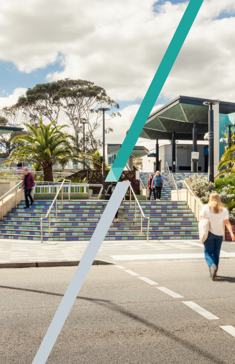 People walking on stairs at train station